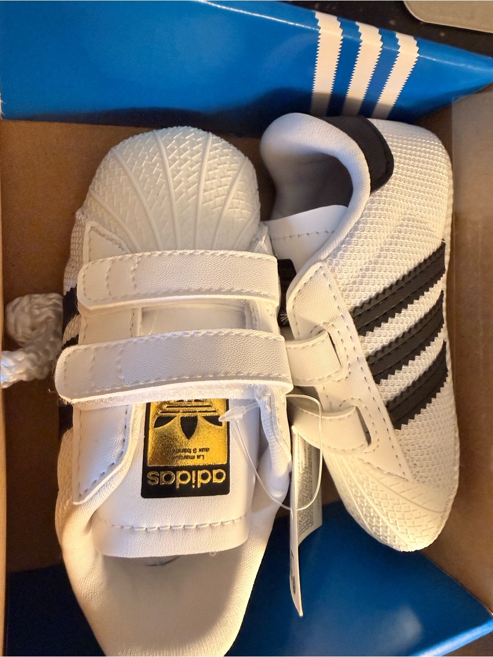 adidas Kids White Sneakers with Black Stripes and Gold Tongue Label